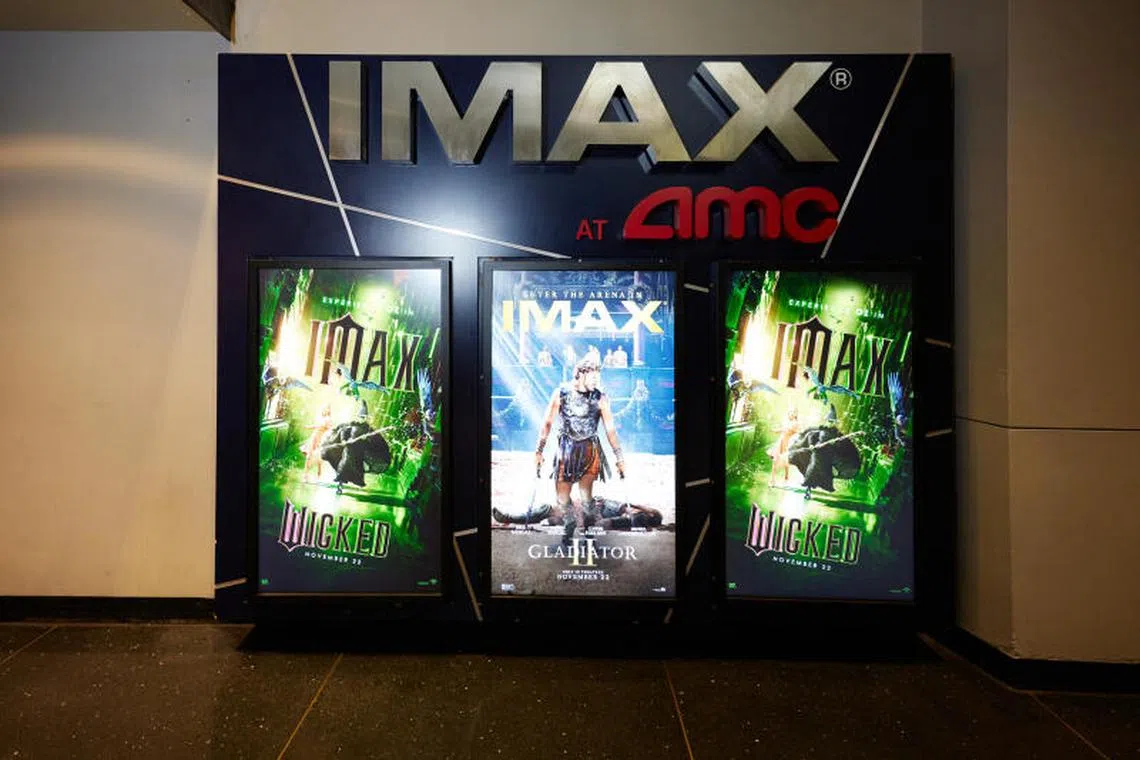 Side-by-side posters for historical Roman epic Gladiator II and musical movie Wicked on their opening day at the AMC Lincoln Square 13 theatre in Manhattan on Nov 22, 2024. 