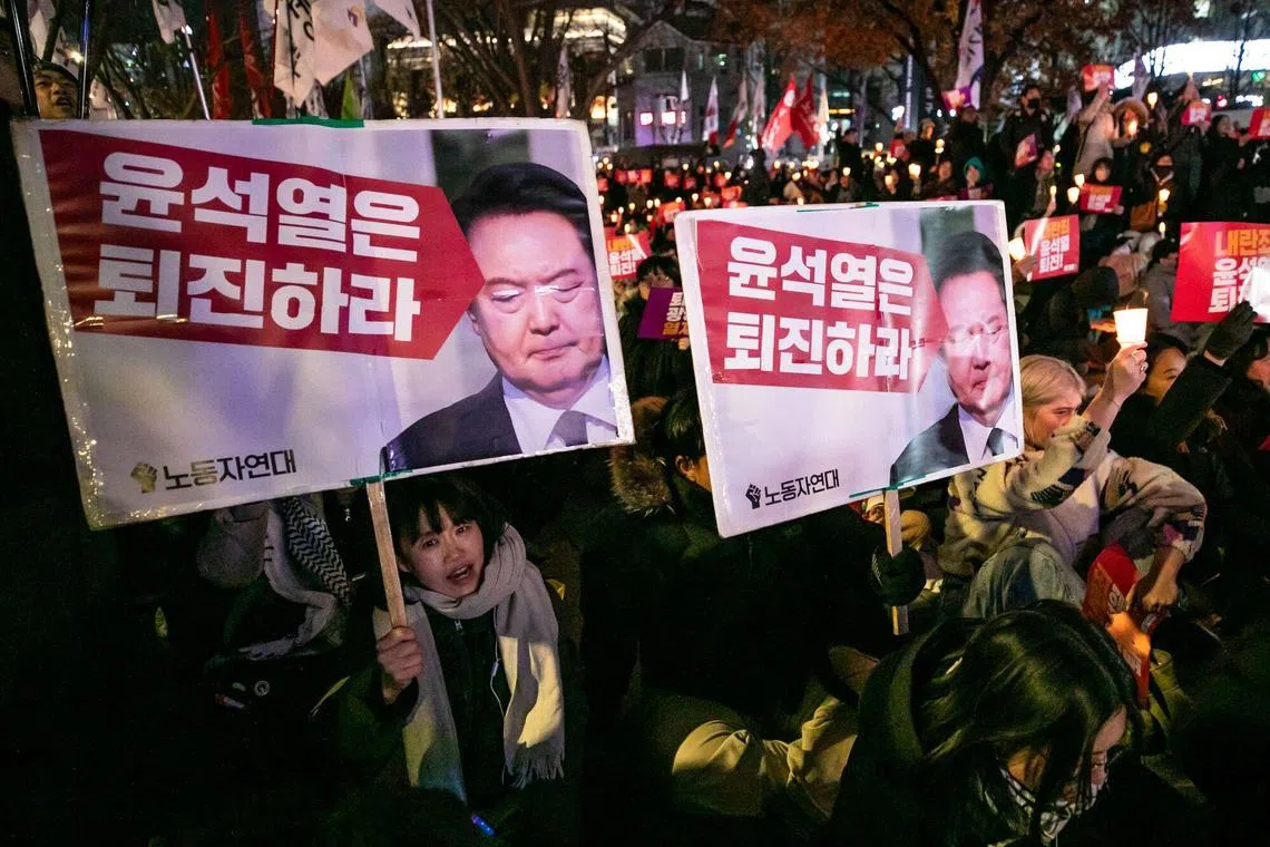 Protesters call for the resignation of South Korean President Yoon Suk Yeol during a demonstration in Gwanghwamun area in Seoul, South Korea, on Wednesday, Dec. 4, 2024. South Korea's main opposition party announced that it would seek to impeach PresidentYoonafter he shocked the nation by briefly imposing martial law. Photographer: Jean Chung/Bloomberg