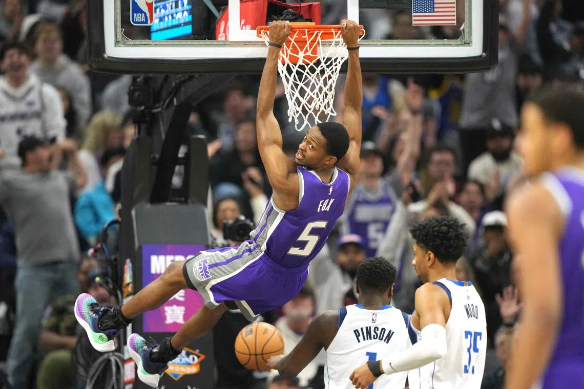 Sacramento Kings guard De'Aaron Fox dunking against the Dallas Mavericks during their NBA match on Feb 11, 2023.