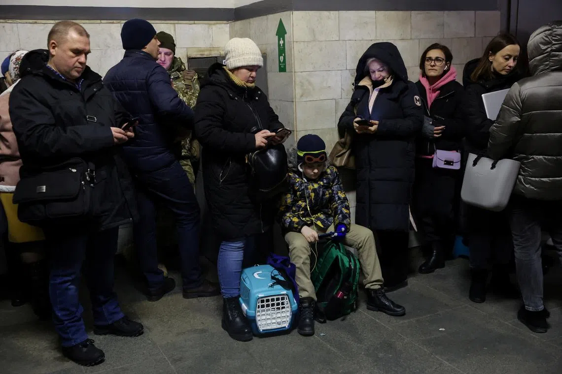 People take shelter inside the metro station amid Russian missile attacks in Kyiv, on Dec 5, 2022.