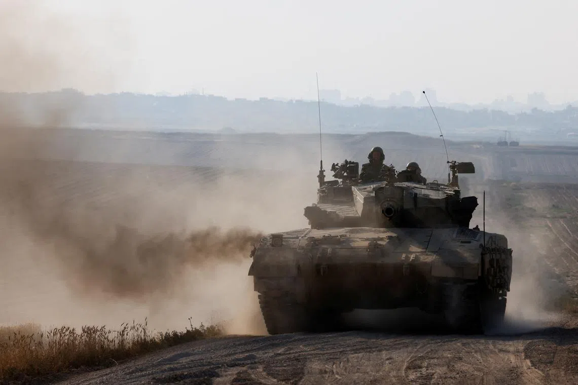 Israeli tank maneuvers near Israel's border with Gaza, amid the ongoing conflict between Israel and the Palestinian Islamist group Hamas, in southern Israel, April 7, 2024. REUTERS/Amir Cohen