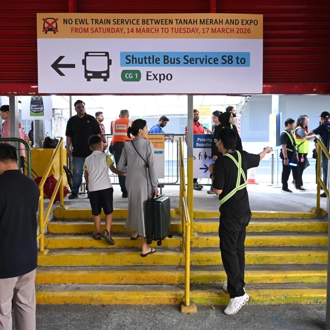 Staff directing passengers to shuttle service S8 at Tanah Merah MRT station on March 14.