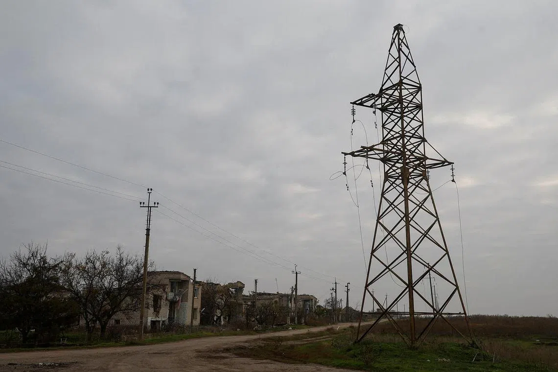 Damaged electric lines are seen in the village of Osokorivka, in Ukraine's Kherson region, on Nov 9, 2022.