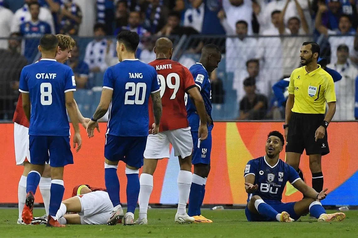 Salem Al Dawsari (right) went from hero to villain after he scored an opener for Al Hilal but then saw red in the final minutes for kicking Ken Iwao.