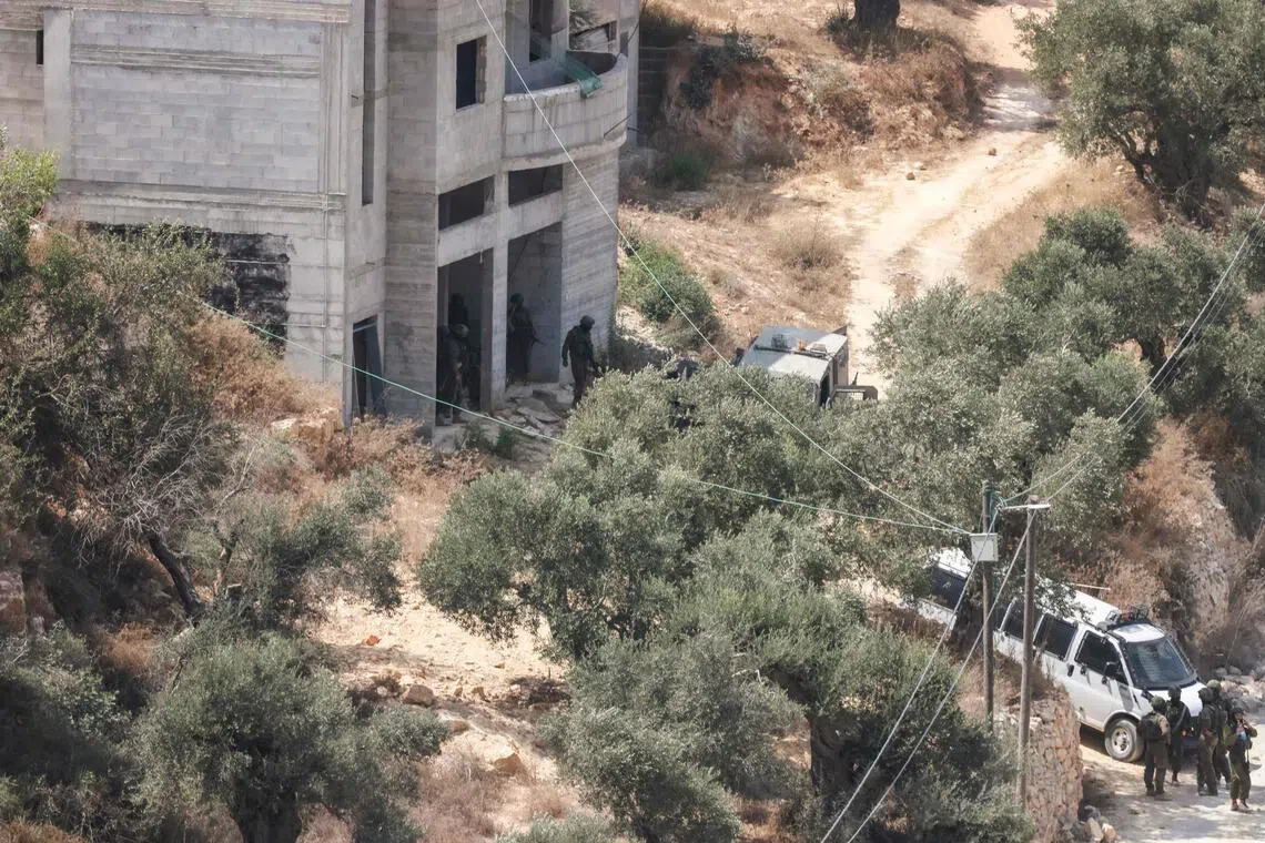 Israeli soldiers arrive at the scene where Israeli settlers attacked a Paletinian home in the village of Qusra, south of the city of Nablus in the Israeli-occupied West Bank, which has faced escalating Jewish settler violence over the past month, on August 29, 2026. Dozens of Israeli settlers attacked the Palestinian village of Qusra in the northern occupied West Bank on August 29, residents and the military said, after nearly three weeks of tension in the area. Earlier in August, a group of settlers began blocking supplies from entering Palestinian houses on the outskirts of the village near Nablus, trapping residents inside and drawing domestic and international condemnation. (Photo by Jaafar ASHTIYEH / AFP)
