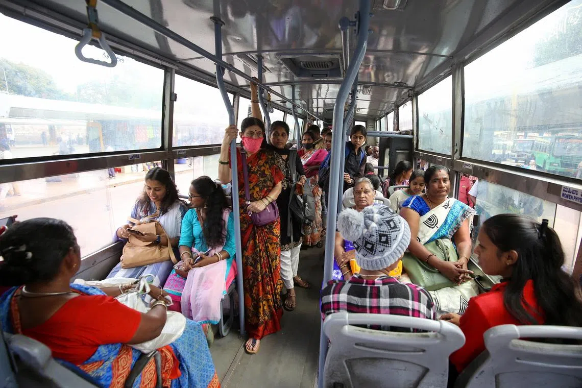 epa11026405 Indian women travel free of charge under Shakti scheme in a public bus in Bangalore, Karnataka state, India, 13 December 2023. The Shakti scheme, which was launched by the state government of Karnataka in June 2023 to empower women by providing them free-of-cost transport in state-run public buses across Karnataka, has crossed one billion travelers between June until November 2023, Chief Minister of Karnataka Siddaramaiah said. EPA-EFE/JAGADEESH NV