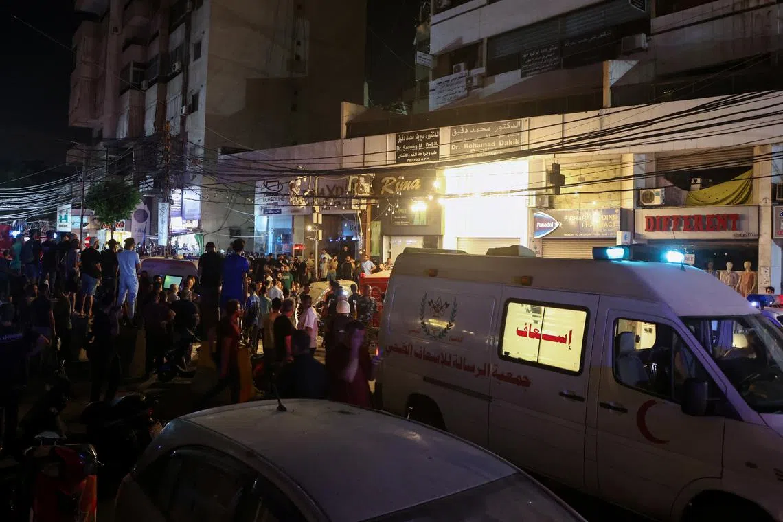 An ambulance is parked near a site hit by what security sources said was a strike on Beirut's southern suburbs, Lebanon July 30, 2024. REUTERS/Mohamed Azakir