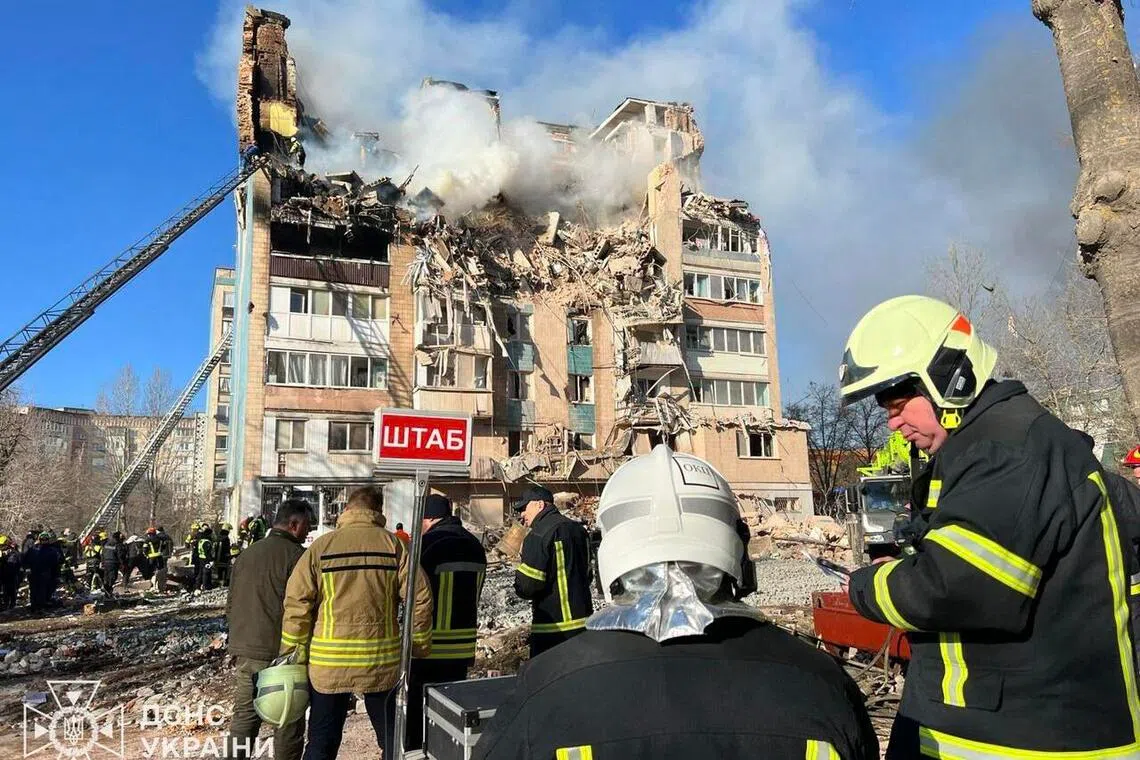 Ukrainian emergency personnel working at the site of a Russian air strike on a residential building in Ternopil, Ukraine, on Nov 19.