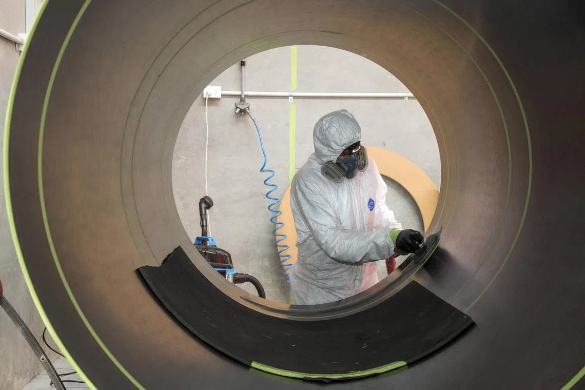 FILE PHOTO: A Rocket Lab technician cleans a fuselage in Auckland, New Zealand, October  20, 2015. REUTERS/Nigel Marple/File Photo