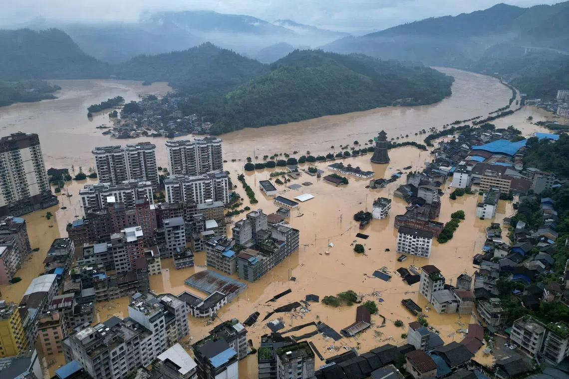 FILE PHOTO: A drone view shows buildings and roads are half submerged in floodwaters after heavy rainfalls, in Rongjiang county, Guizhou province, China June 24, 2025. China Daily via REUTERS/File Photo