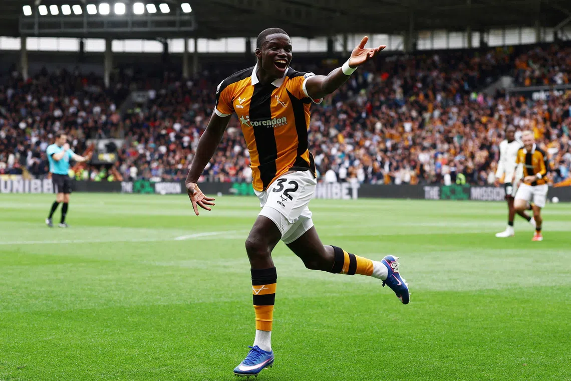 Hull City’s Nobel Mendy celebrates scoring their second goal against Manchester United on Aug 22.