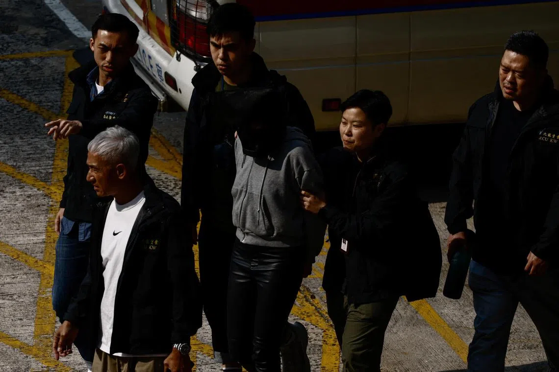 A suspect involved in the murder of model Abby Choi is seen at a police station on March 7, 2023.