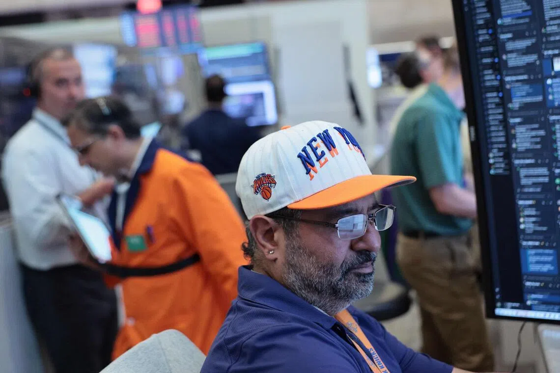 Traders working on the floor of the New York Stock Exchange during afternoon trading on June 10, in New York City.