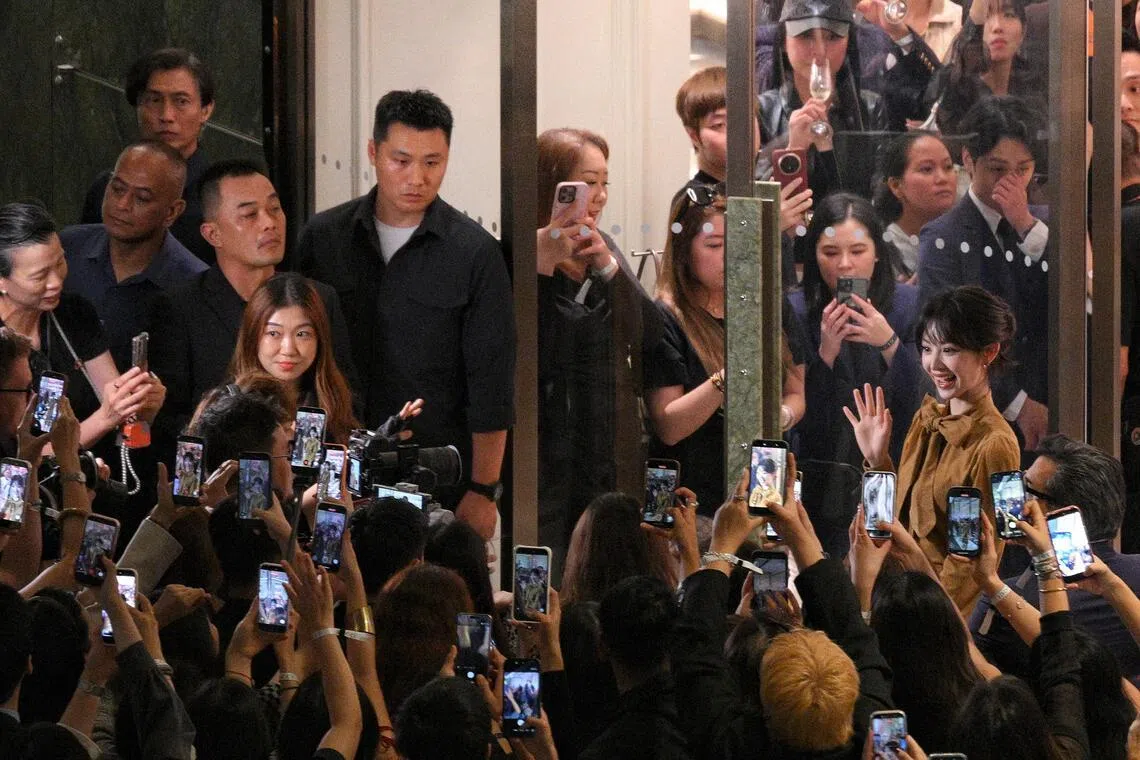 Pursuit of Jade actress Tian Xiwei (right) arriving at Gucci’s Marina Bay Sands flagship store on May 22.