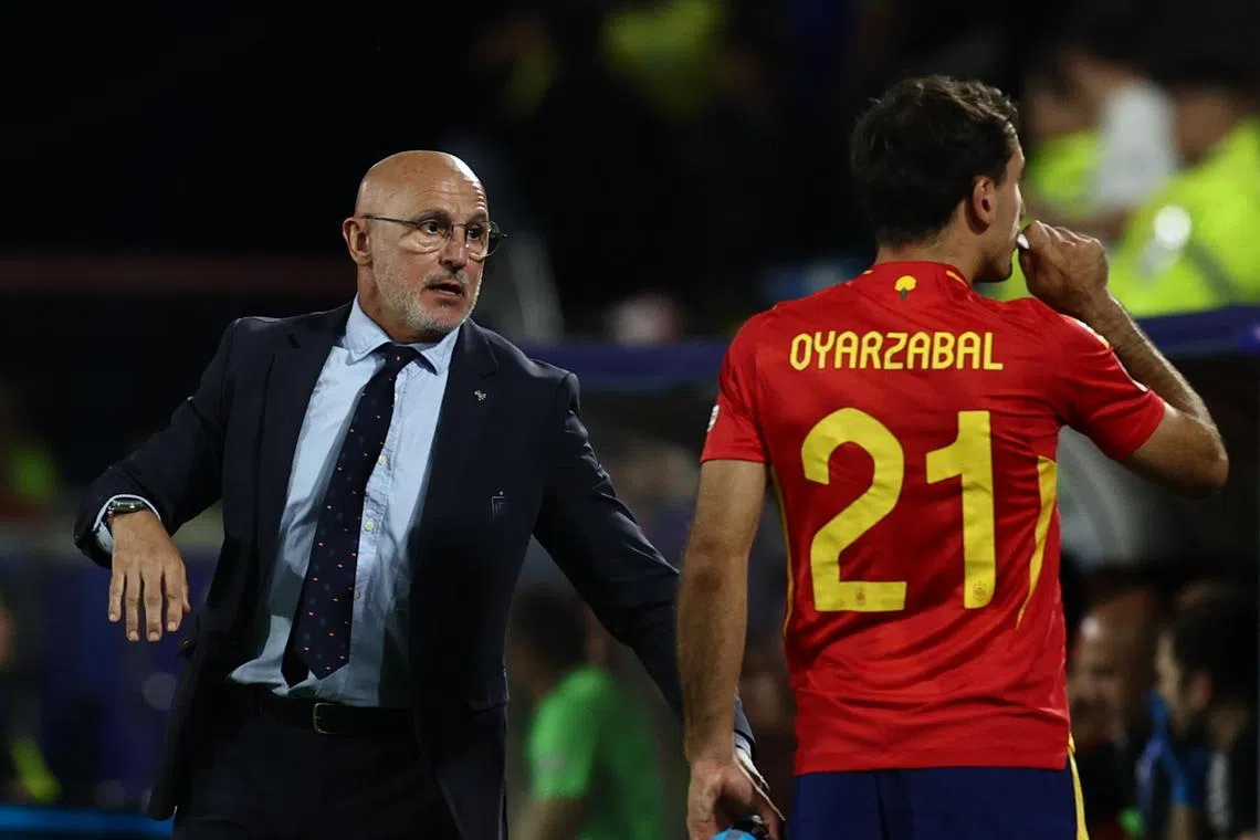Coach Luis de la Fuente of Spain giving instructions Mikel Oyarzabal during the Euro 2024 last-16 win over Georgia on June 30. He has moved La Roja away from "tiki-taka" to a more vertical style.