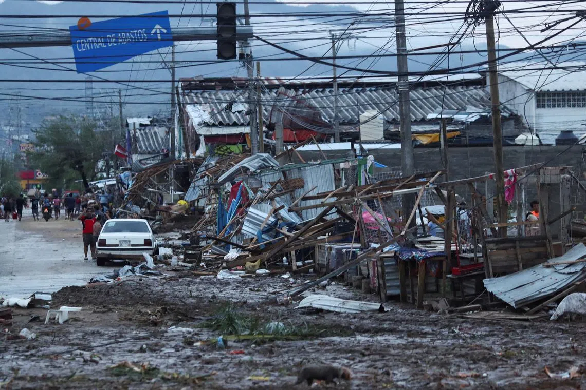 Street stalls and properties were damaged by Hurricane Otis near the entrance to Acapulco, in the Mexican state of Guerrero, Mexico on October 25.
