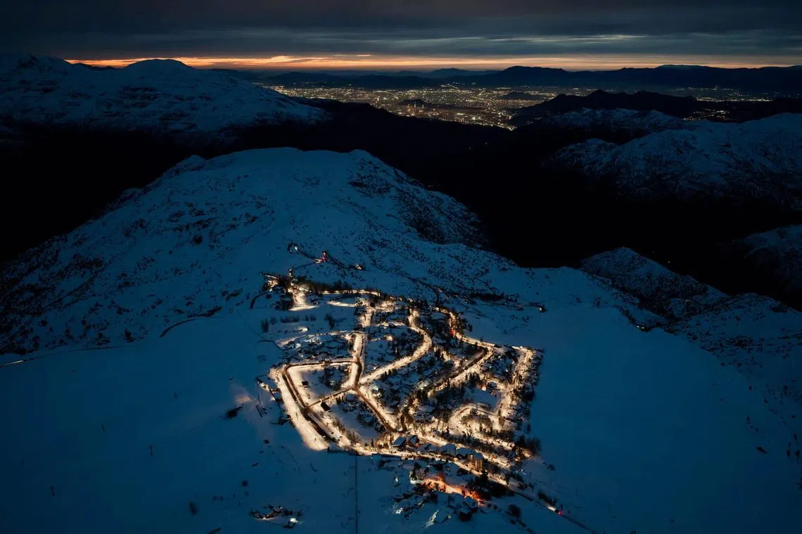 TOPSHOT - This aerial view shows El Colorado ski resort located in Lo Barnechea, Santiago, on July 22, 2026, following heavy rains. Three people died and 76 were affected by a storm with heavy rains, swells, and winds that is impacting 10 of the country’s 16 regions, the government reported. (Photo by Javier TORRES / AFP)
