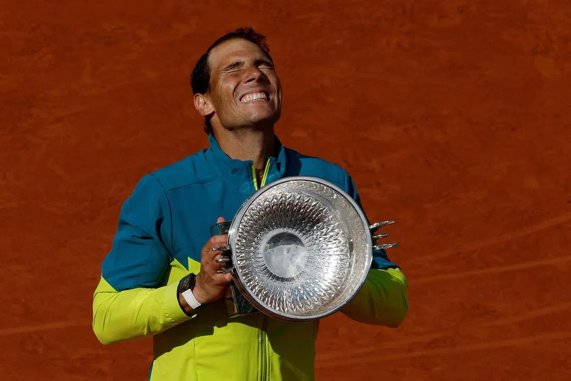 FILE PHOTO: Tennis - French Open - Roland Garros, Paris, France - June 5, 2022
Spain's Rafael Nadal celebrates with trophy after winning the men's singles final against Norway's Casper Ruud REUTERS/Gonzalo Fuentes/File Photo