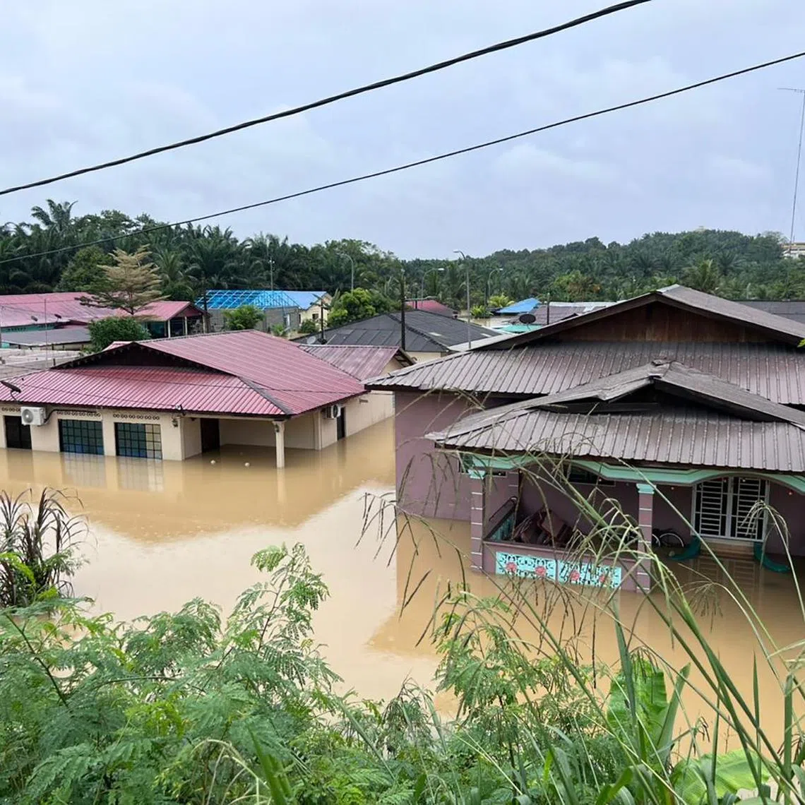 YONG PENG - Flooded homes in Yong Peng town, northwest Johor, on Saturday. 
