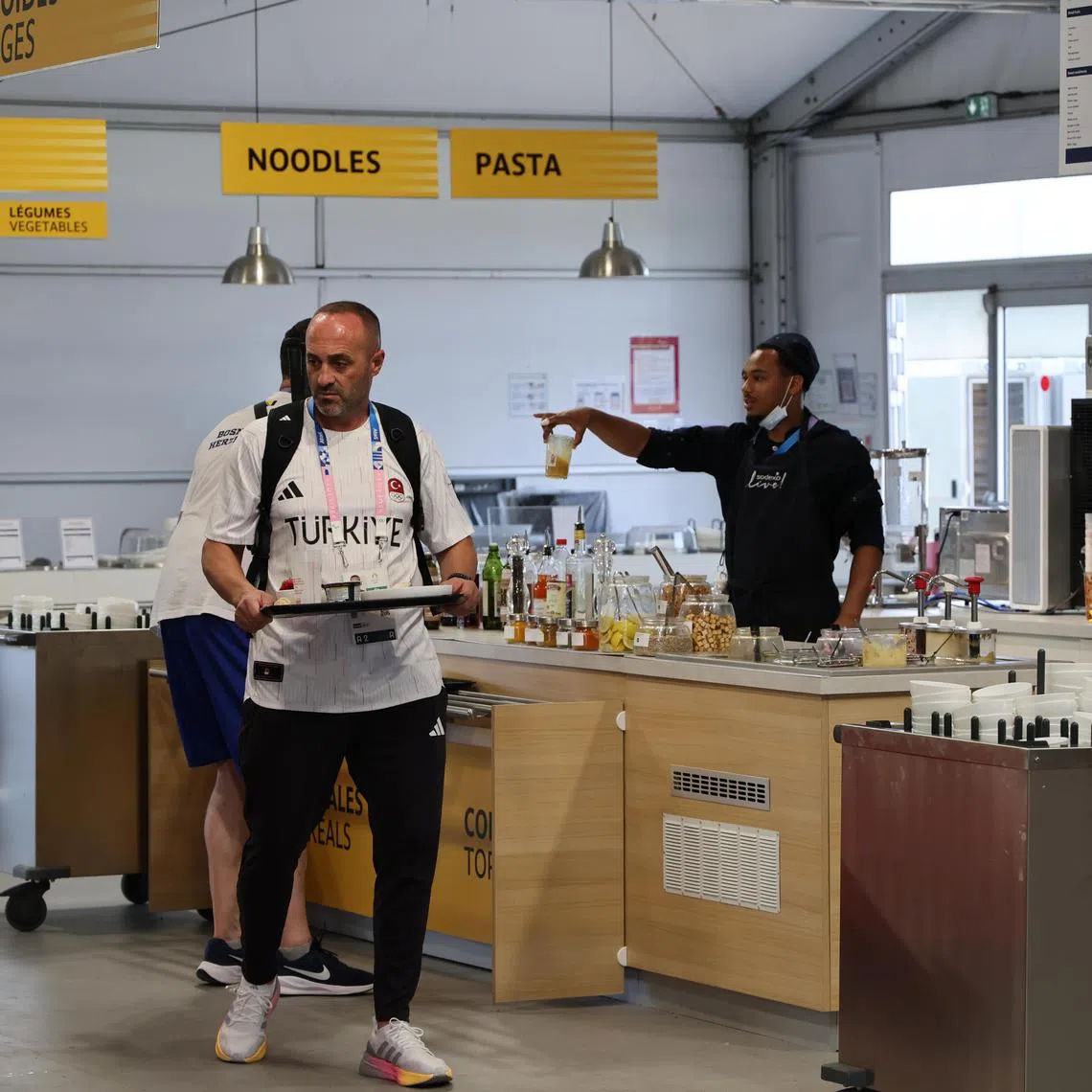 Views of the dining hall inside the Olympic Village at St Denis