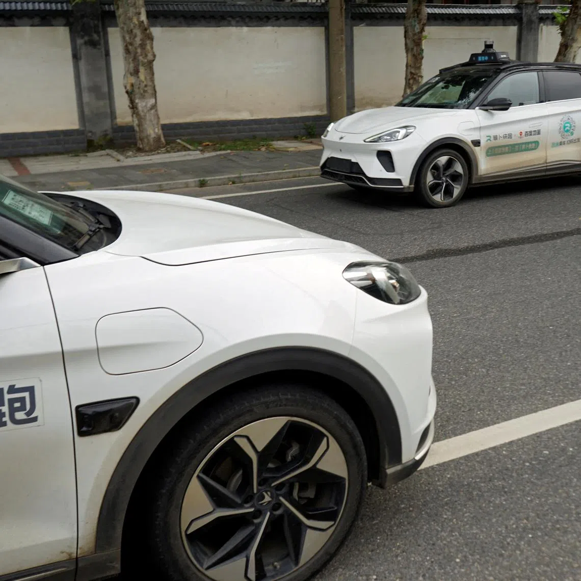 A driverless car by Apollo Go, Baidu's robotaxi service, drives past in Wuhan. The technology firm is said to be looking to launch its service in Europe.