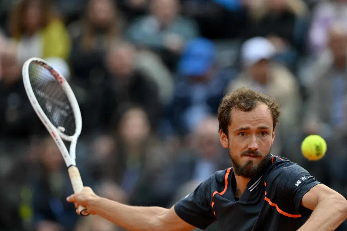TOPSHOT - Russia's Daniil Medvedev plays a forehand return to Denmark's Holger Rune during the final of the Men's ATP Rome Open tennis tournament on the central court of Foro Italico in Rome on May 21, 2023. (Photo by Tiziana FABI / AFP)