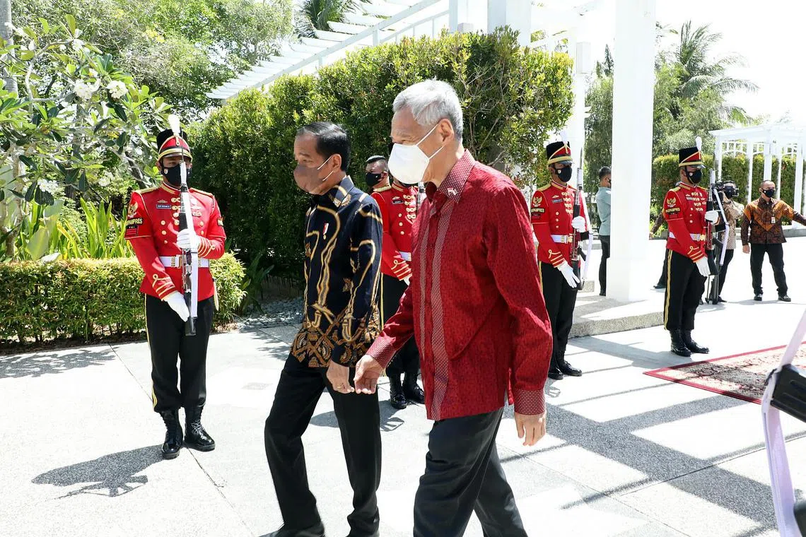 PM Lee Hsien Loong (right) and Indonesian President Joko Widodo at the Leaders' Retreat in Bintan, Indonesia, on Jan 25, 2022.