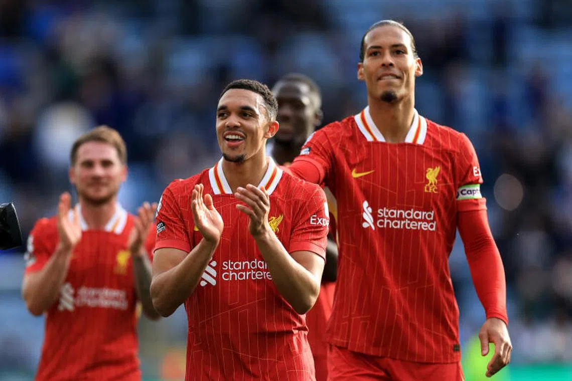 Soccer Football - Premier League - Leicester City v Liverpool - King Power Stadium, Leicester, Britain - April 20, 2025 Liverpool's Trent Alexander-Arnold and Liverpool's Virgil van Dijk celebrate after the match Action Images via Reuters/Andrew Boyers EDITORIAL USE ONLY. NO USE WITH UNAUTHORIZED AUDIO, VIDEO, DATA, FIXTURE LISTS, CLUB/LEAGUE LOGOS OR 'LIVE' SERVICES. ONLINE IN-MATCH USE LIMITED TO 120 IMAGES, NO VIDEO EMULATION. NO USE IN BETTING, GAMES OR SINGLE CLUB/LEAGUE/PLAYER PUBLICATIONS. PLEASE CONTACT YOUR ACCOUNT REPRESENTATIVE FOR FURTHER DETAILS..