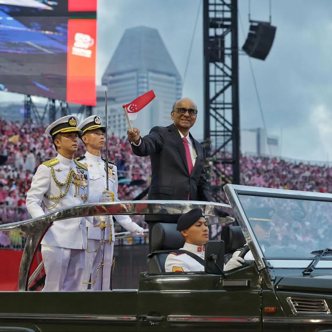 President Tharman Shanmugaratnam waving at spectators during the National Day Parade at the Padang on Aug 9.