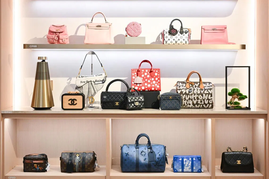 Secondhand designer bags on display inside Carousell Luxury store at The Centrepoint, Orchard Road.