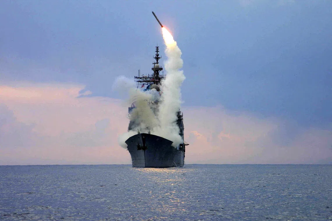 FILE PHOTO: A Tomahawk Land Attack Missile (TLAM) is launched from the guided missile cruiser USS Cape St. George, arch 23, 2003.   REUTERS/U.S. Navy/Intelligence Specialist 1st Class Kenneth Moll/File Photo