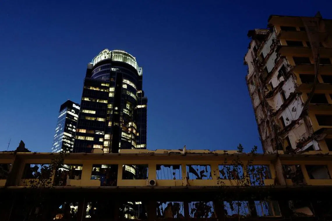 A construction site with a demolished building is seen near skyscrapers in the centre of Warsaw, Poland October 30, 2017. REUTERS/Kacper Pempel/File photo