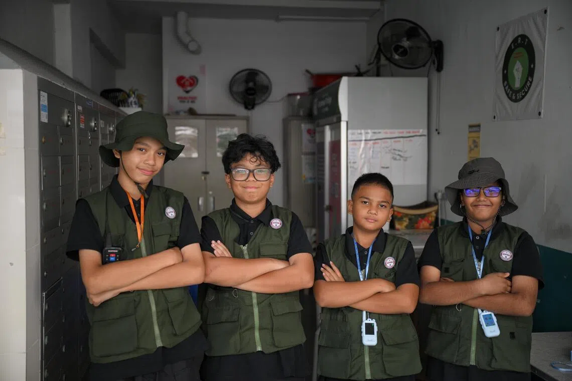 (From left) Didie Andiqa Muhaimin, 14, Rafieq Sahin Rafizal, 12, Al-Mirza Danish, 12, and Aaron Sarandev, 11, make up the Emergency Response Team LB (Lengkok Bahru), patrolling their neighbourhood every day to keep it safe.