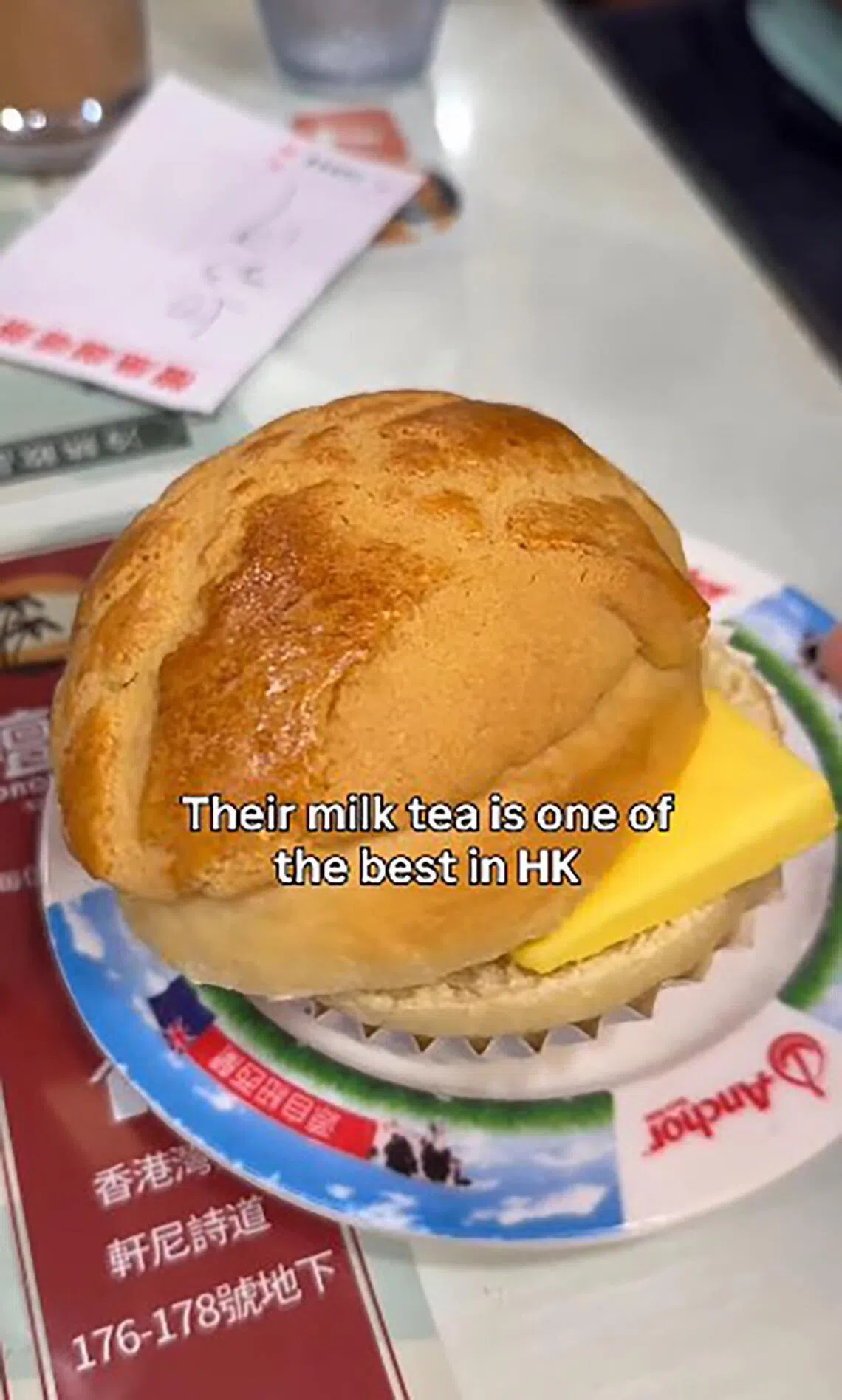 Ms Chan documenting her pineapple bun dish, served at 80-year-old Honolulu Coffee Shop in Wan Chai on its last day of business on March 1.