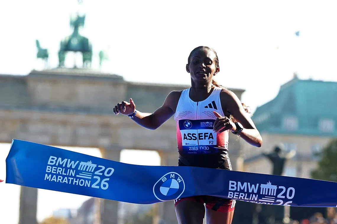 Athletics - Berlin Marathon - Berlin, Germany - September 27, 2026 Ethiopia's Tigst Assefa crosses the line to win the women's elite race REUTERS/Lisi Niesner