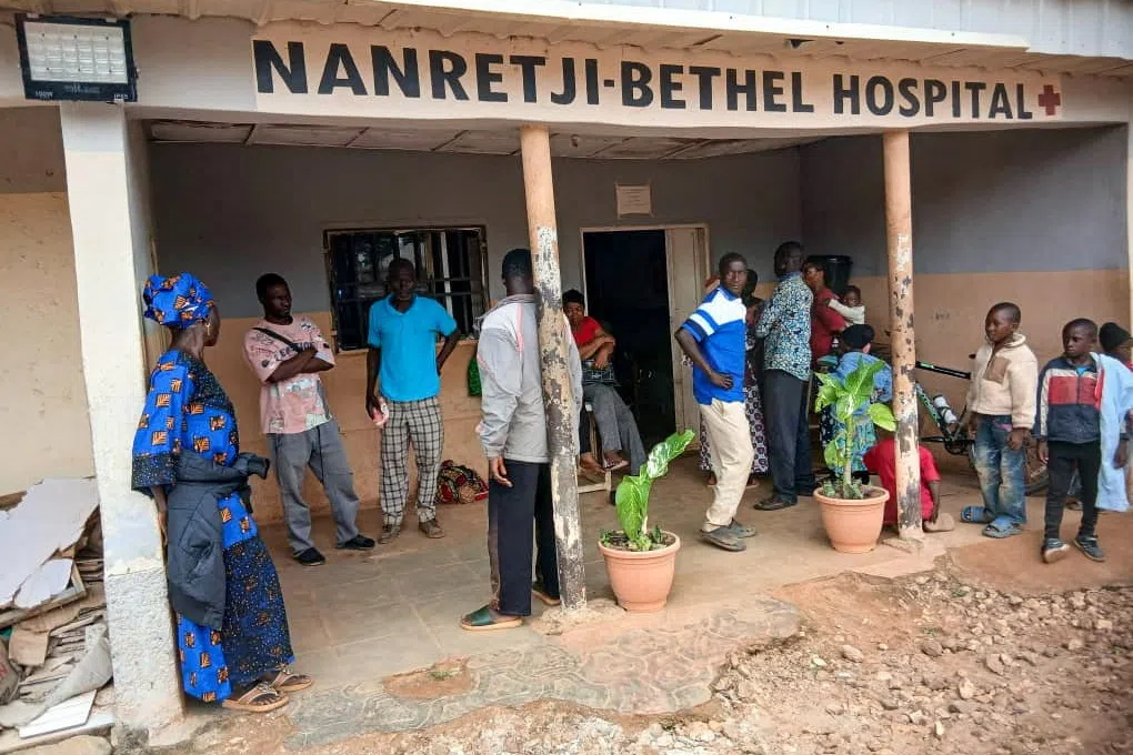Relatives wait outside Nanetji-Betgel Hospital for family members undergoing treatment amid fears of reprisals after an attack that killed dozens of people in Mangu Local Government Area in Plateau State, Nigeria, August 18, 2026. REUTERS/Stringer