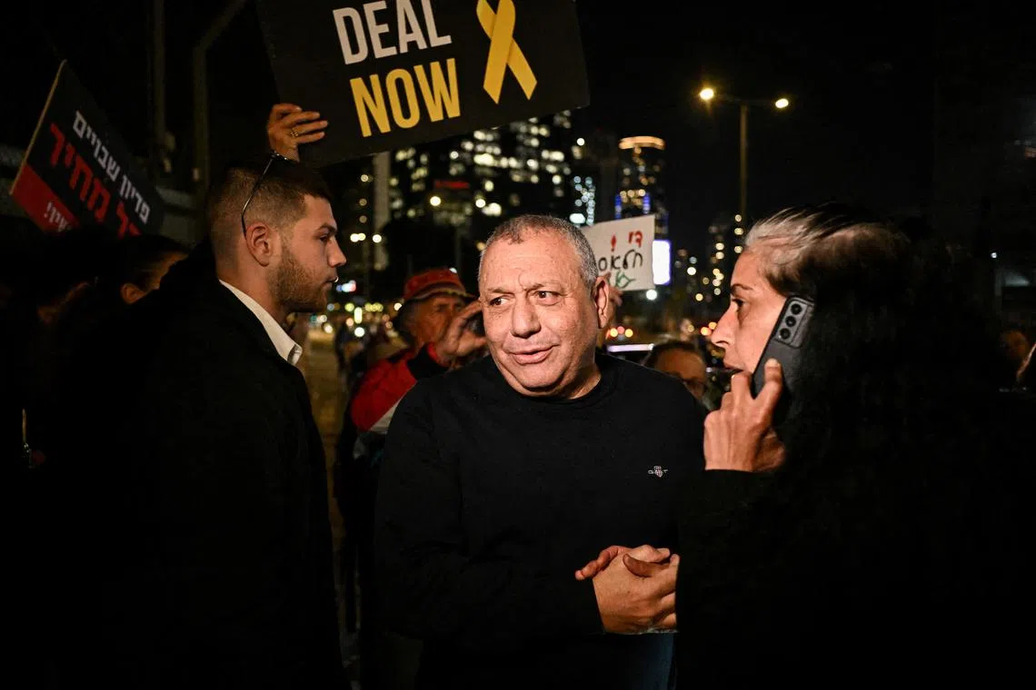 Knesset member Gadi Eisenkot, an observer in the war Cabinet, speaking to protesters at a February rally calling for the release of hostages kidnapped by Hamas during their Oct 7 attack on Israel.