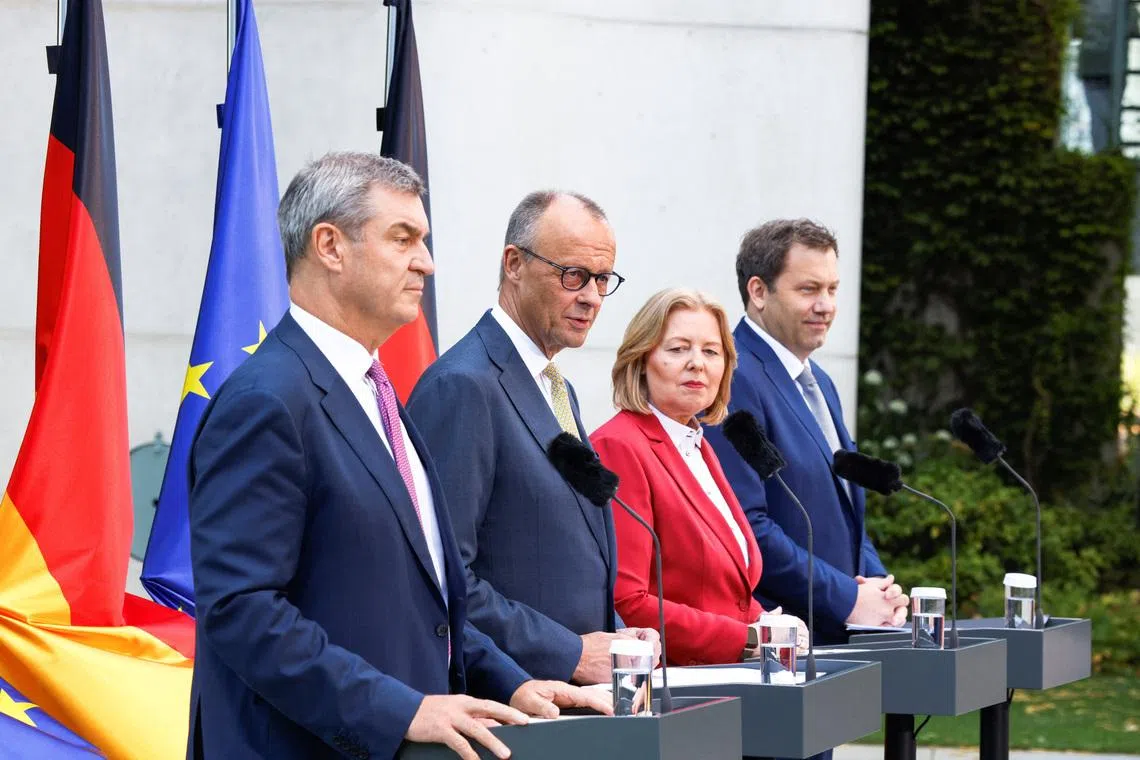 (From left) Bavarian State Premier Markus Soeder, German Chancellor Friedrich Merz, Labour and Social Affairs Minister Baerbel Bas and Finance Minister Lars Klingbeil in Berlin on July 2.