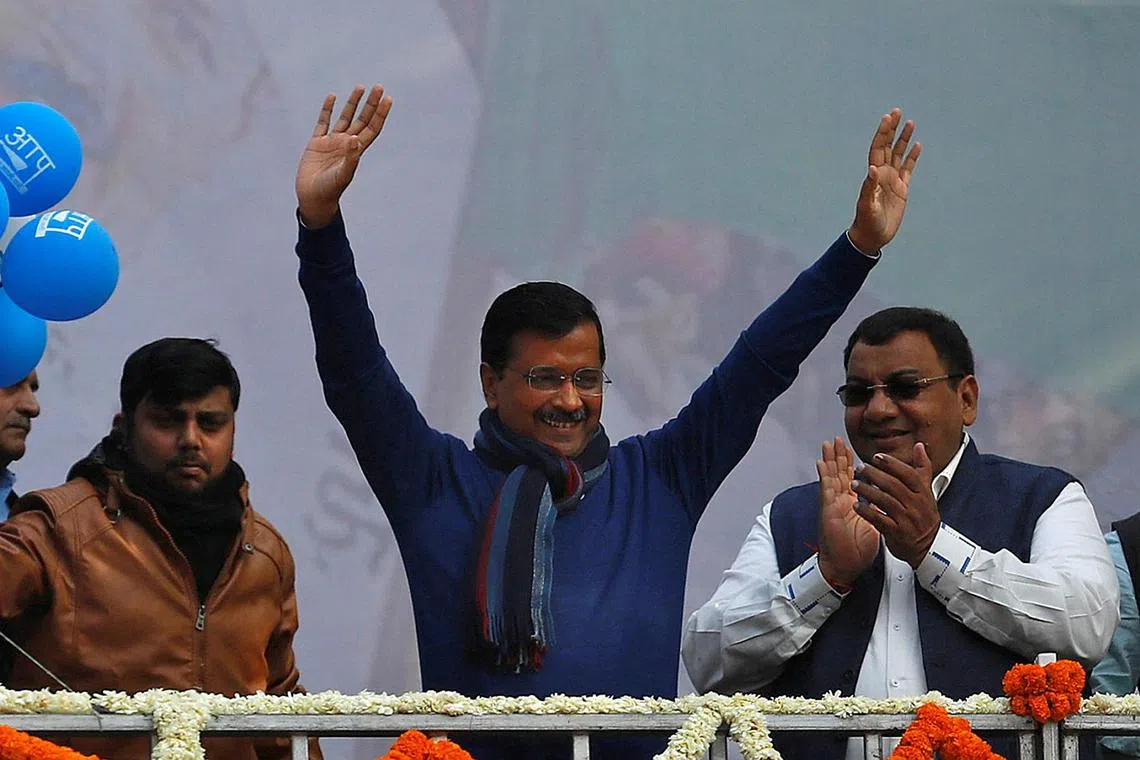 The Aam Aadmi Party, led by Delhi Chief Minister Arvind Kejriwal (centre) is leading the polls in the Delhi polls.