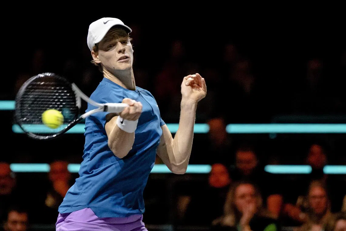 Italy's Jannik Sinner hits a ball to Stefanos Tsitsipas of Greece at the Rotterdam Open.