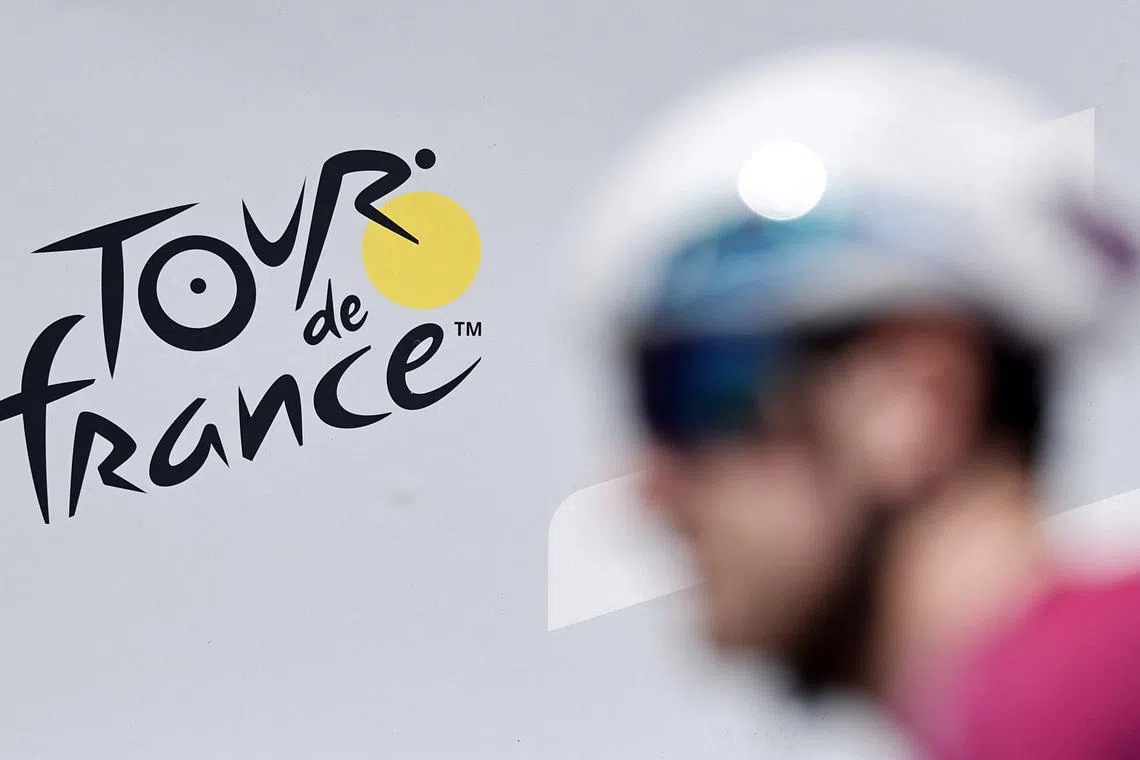 FILE PHOTO: Cycling - Tour de France - Stage 11 - Toulouse to Toulouse - Toulouse, France - July 16, 2025 Israel - Premier Tech's Joseph Blackmore goes by the Tour de France logo before stage 11 REUTERS/Benoit Tessier/File Photo