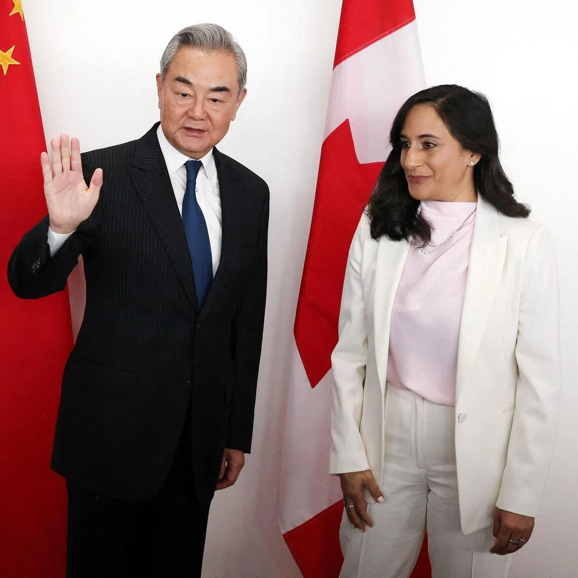 Canadian Foreign Minister Anita Anand (right) and Chinese Foreign Affairs Minister Wang Yi posing for a photo ahead of a bilateral meeting in Ottawa, on May 29.