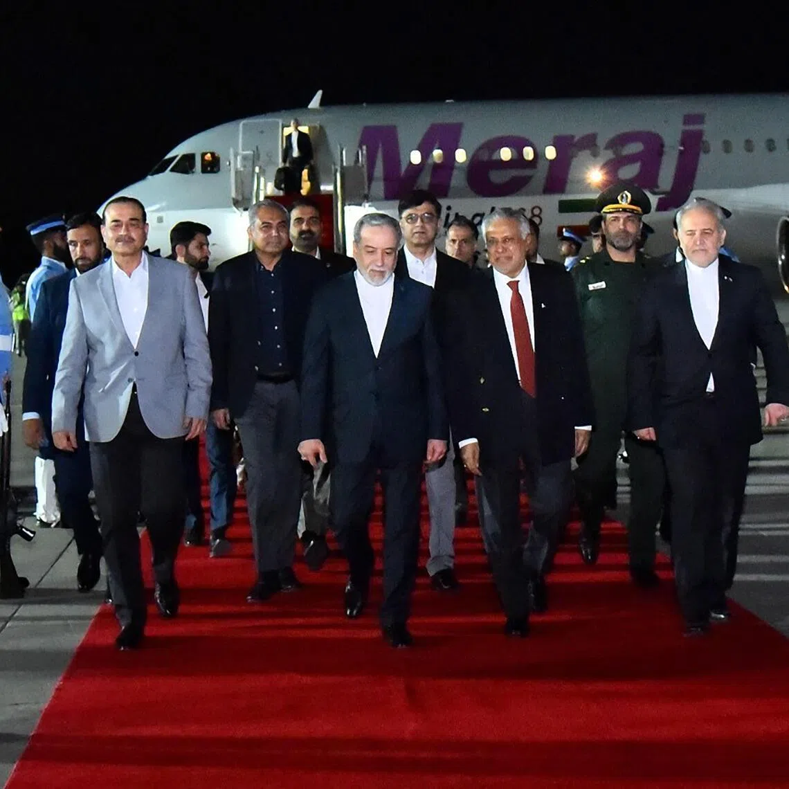 This handout photograph taken and released by Pakistan's Prime Minister Office on April 25, 2026 shows Pakistan's Foreign Minister Ishaq Dar (C-R) and Army Chief Syed Asim Munir (2ndL) walking with Iran's Foreign Minister Abbas Araghchi (C) upon his arrival at Nur Khan air base in Rawalpindi, near Islamabad. Abbas Araghchi arrived in Islamabad on April 24, Pakistan's foreign ministry said, ahead of planned Iran-US peace negotiations. (Photo by Aamir QURESHI / Pakistan's Prime Minister Office / AFP) / RESTRICTED TO EDITORIAL USE - MANDATORY CREDIT "AFP PHOTO /Pakistan's Prime Minister Office " - HANDOUT - NO MARKETING NO ADVERTISING CAMPAIGNS - DISTRIBUTED AS A SERVICE TO CLIENTS