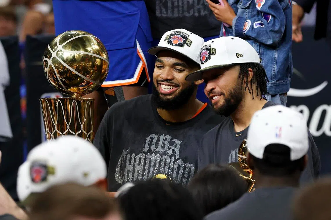 New York Knicks centre Karl-Anthony Towns (left) and guard Jalen Brunson celebrates with team-mates after the Knicks defeat the San Antonio Spurs.
