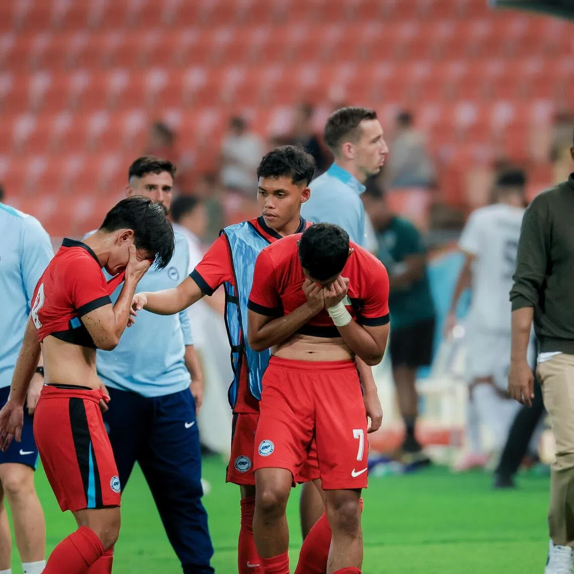 Singapore Men's under-22 football players reacting after the final whistle during the group match at the Rajamangala National Stadium during the Thailand Southeast Asian Games in Bangkok on Dec 6, 2025.