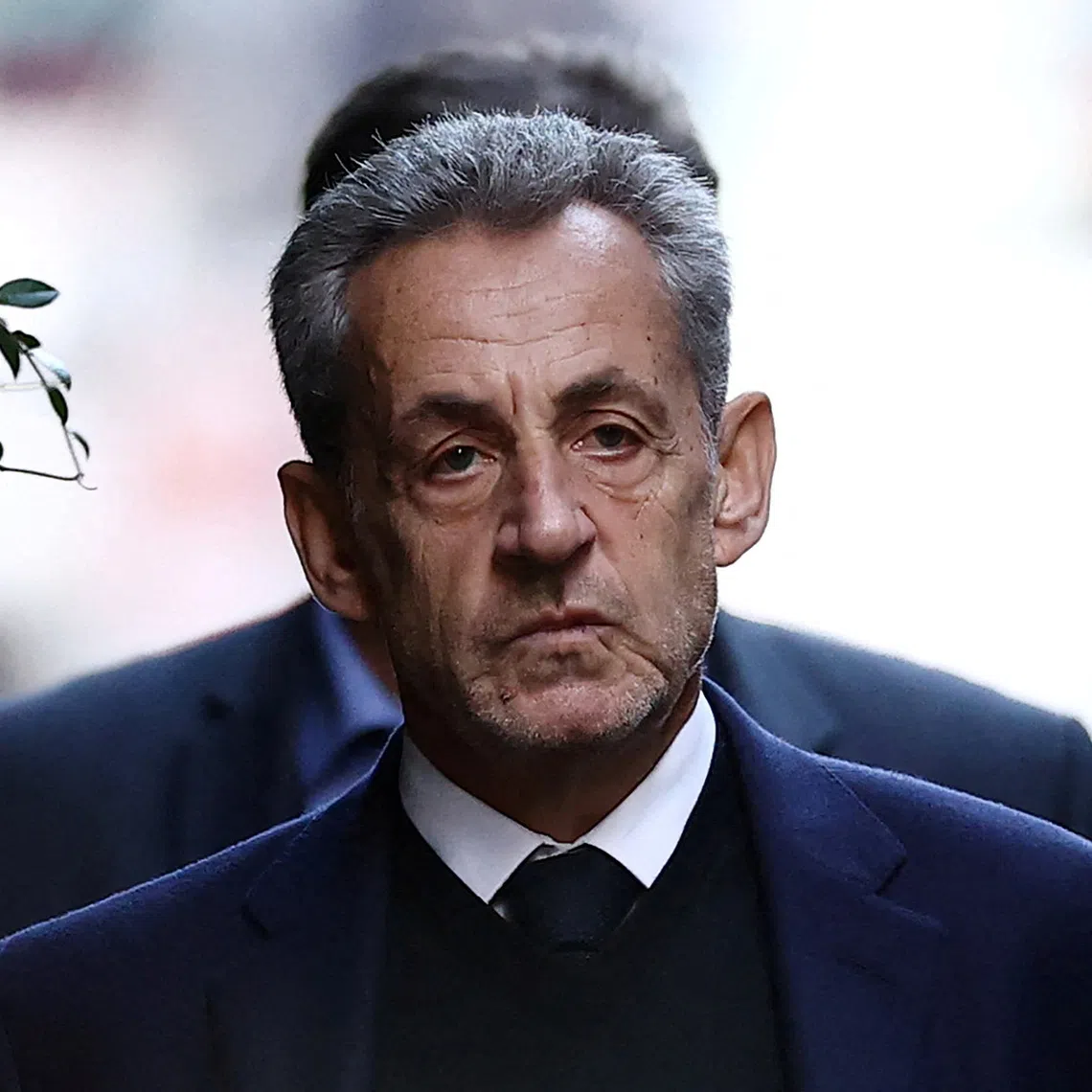 FILE PHOTO: Former French president Nicolas Sarkozy leaves his house on the day of his incarceration at the Sante prison to begin his five-year prison sentence for criminal conspiracy over attempts to raise campaign funds from Libya, in Paris, France, October 21, 2025. REUTERS/Sarah Meyssonnier/File Photo