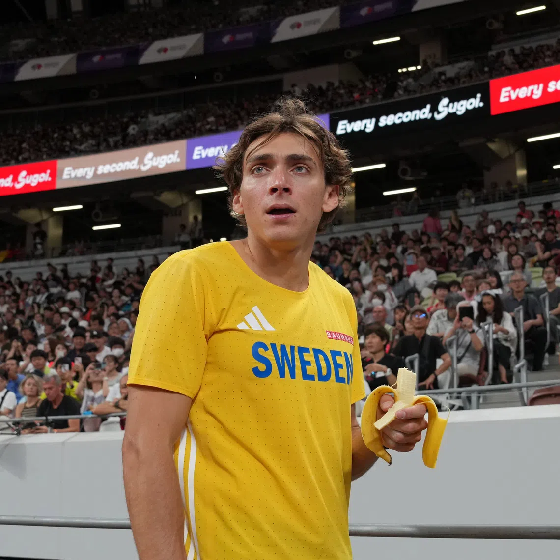 Sep 13, 2025; Tokyo, Japan; Mondo Duplantis aka Armand Duplantis (SWE) holds a banana during the pole vault qualifying at the World Athletics Championships at National Stadium. Mandatory Credit: Kirby Lee-Imagn Images