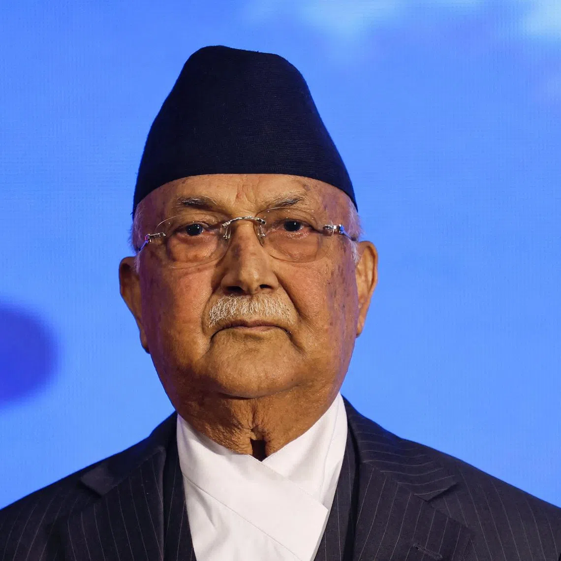 Former Prime Minister of Nepal and Chairman of Communist Party of Nepal (Unified Marxist- Leninist) K.P Sharma Oli, who was forced to resign after the deadly youth-led protests against corruption in early September last year, poses for a picture before releasing a manifesto ahead of the elections of the House of Representatives scheduled for March 5, 2026, following the deadly \"Gen Z\" led anti-graft protests in September that toppled the government, in Kathmandu, Nepal, February 19, 2026. REUTERS/Navesh Chitrakar