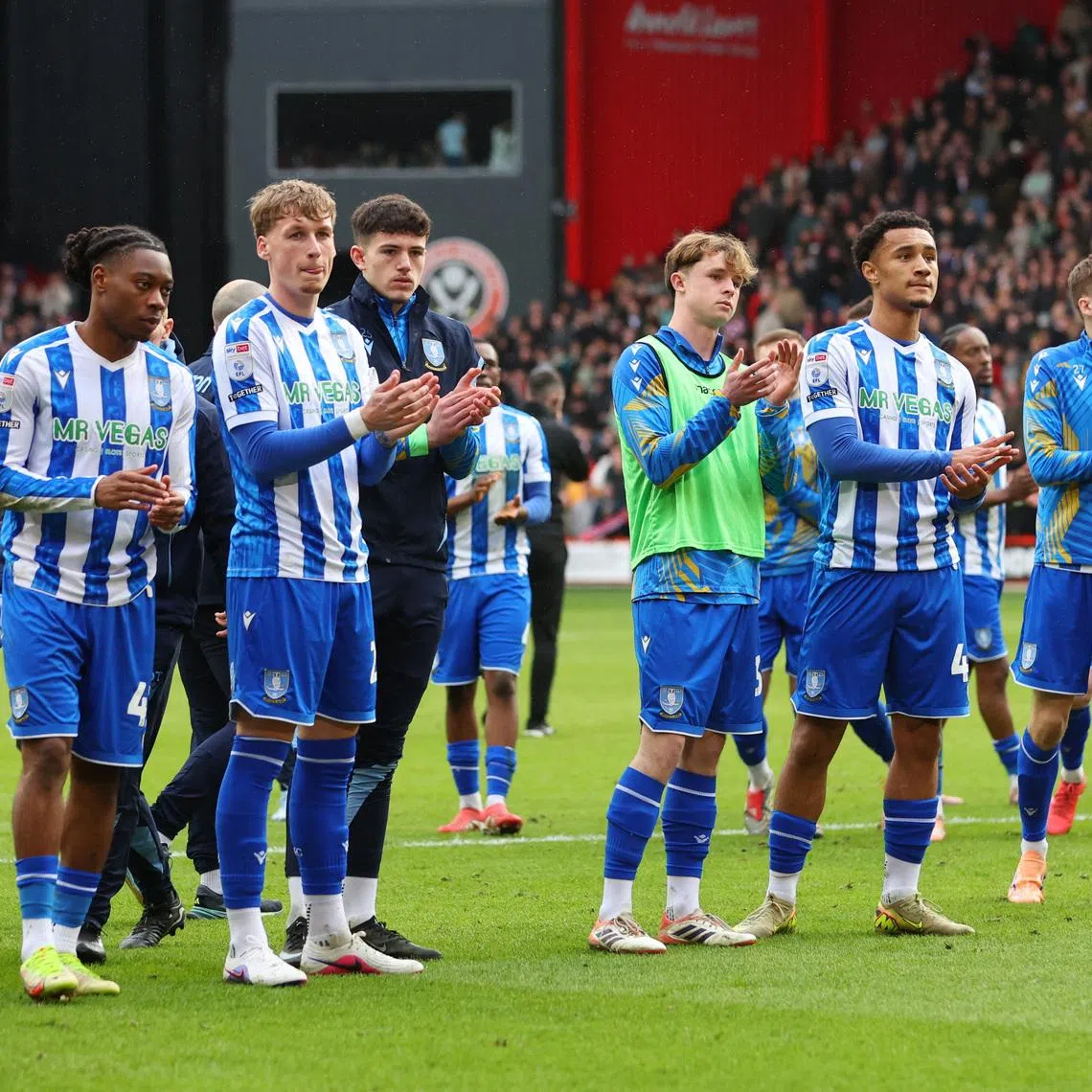 Soccer Football - Championship - Sheffield United v Sheffield Wednesday - Bramall Lane, Sheffield, Britain - February 22, 2026 Sheffield Wednesday players look dejected after the match as they are relegated from the Championship Action Images/Craig Brough