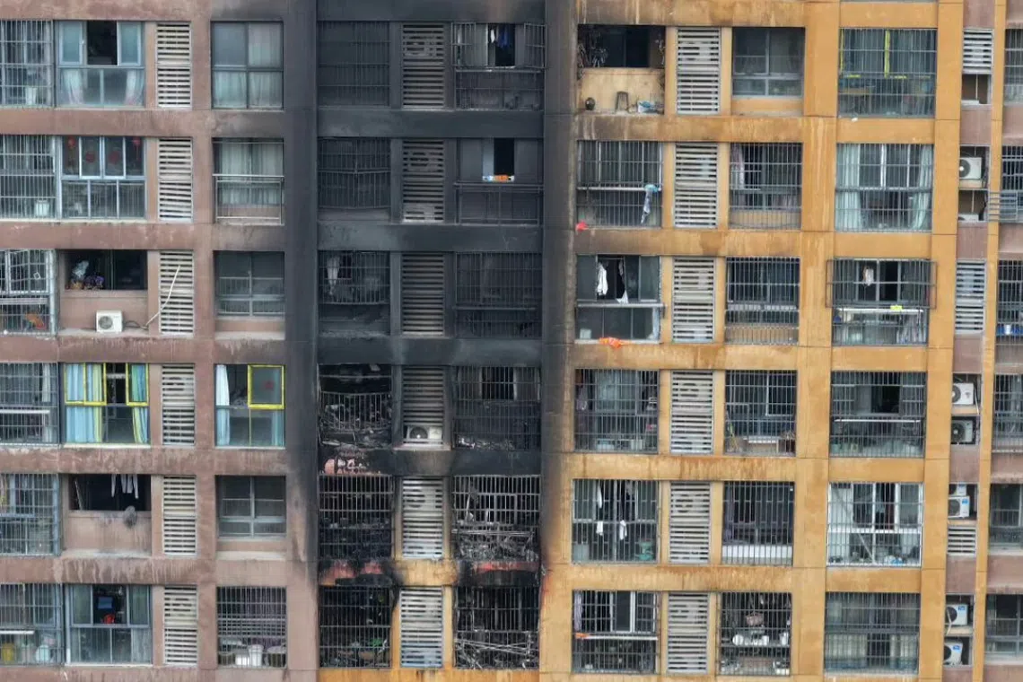 The fire broke out early Feb 23 morning, officials said at a press conference, with a preliminary investigation suggesting the blaze started on the building’s first floor, where electric bikes had been placed.